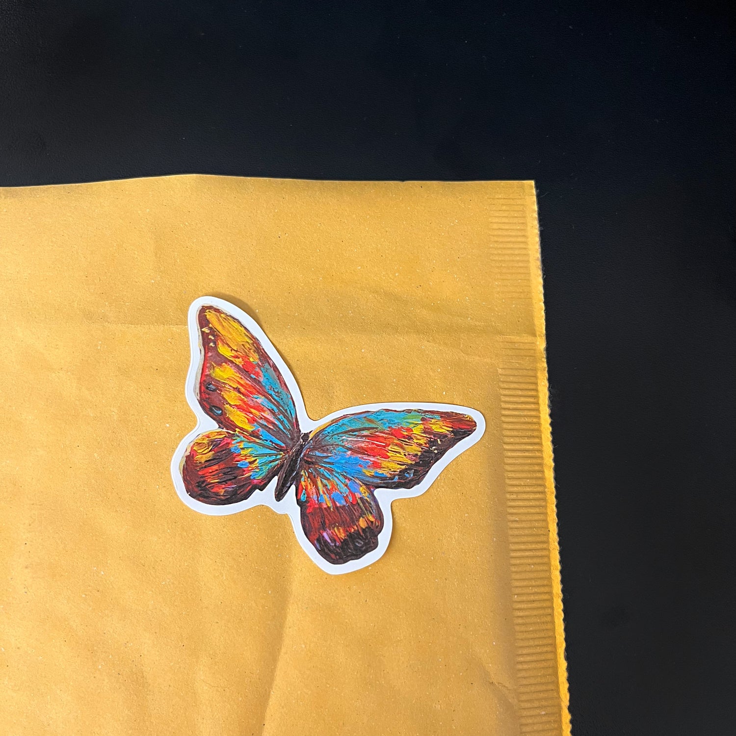 Art print sticker on a mailer for fulfillment