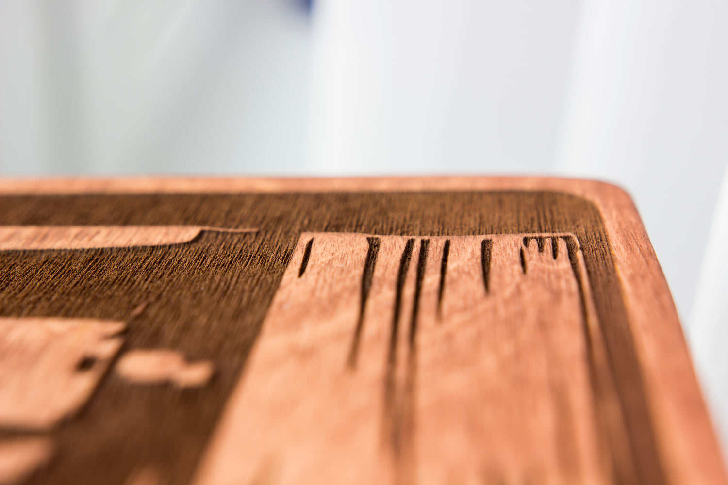 Close up of a laser cut wood block with intricate details